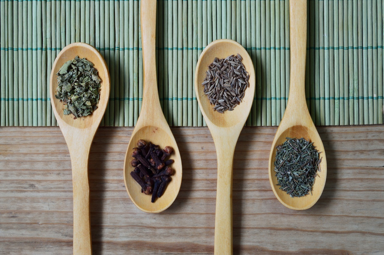 wooden spoons and herbs